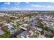 Stunning aerial view of waterfront homes nestled along winding canals under a bright sunny sky at 170 98Th N Ave, St Petersburg, FL 33702