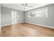 Bright bedroom with hardwood floors, large window, and neutral paint at 170 98Th N Ave, St Petersburg, FL 33702