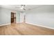 Bedroom with walk-in closet, hardwood floors, and neutral paint at 170 98Th N Ave, St Petersburg, FL 33702