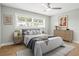 Serene bedroom featuring natural light, minimalist decor, and a comfortable bed for a relaxing atmosphere at 170 98Th N Ave, St Petersburg, FL 33702