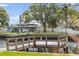 A waterfront dock with a boat lift is a great place to enjoy the canal at 170 98Th N Ave, St Petersburg, FL 33702