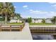 Exterior shot of the home with the canal and private dock in the foreground at 170 98Th N Ave, St Petersburg, FL 33702