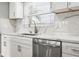 Modern kitchen featuring white cabinets, stainless steel appliances, and quartz countertops at 170 98Th N Ave, St Petersburg, FL 33702