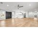 Open-concept living area with kitchen and hardwood floors at 170 98Th N Ave, St Petersburg, FL 33702