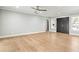 Spacious living area showcasing hardwood floors, and a view of the front entrance at 170 98Th N Ave, St Petersburg, FL 33702