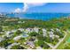 Beautiful aerial view of community with lush landscaping, pool, and bay views, offering a tranquil coastal lifestyle at 3348 38Th S Way # C, St Petersburg, FL 33711