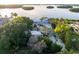 Stunning aerial view of an estate with mature landscaping, a private drive, and waterfront access at 1761 Oceanview Dr, St Petersburg, FL 33715