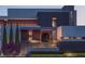 Contemporary home featuring a concrete staircase leading to the front door, as well as lush landscaping at 1761 Oceanview Dr, St Petersburg, FL 33715