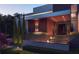 House entrance featuring a wood-clad entry, concrete steps, and professional landscaping at 1761 Oceanview Dr, St Petersburg, FL 33715