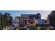 Contemporary home showcasing an architectural design, a manicured lawn, and a multi-car garage at 1761 Oceanview Dr, St Petersburg, FL 33715