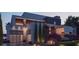 Modern home featuring an attached garage, manicured landscaping, and exterior architectural lighting at 1761 Oceanview Dr, St Petersburg, FL 33715
