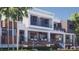 Exterior of modern house with multiple balconies, glass railings, and a swimming pool in the foreground at 1761 Oceanview Dr, St Petersburg, FL 33715