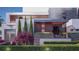 Stunning modern home exterior featuring manicured landscaping and architectural detail at 1761 Oceanview Dr, St Petersburg, FL 33715