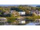 Breathtaking waterfront home featuring modern architecture, a private dock, and lush landscaping at 1761 Oceanview Dr, St Petersburg, FL 33715