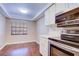 Eat-in kitchen with stainless steel appliances and wood flooring at 2020 Lakeview Dr # 203, Clearwater, FL 33763
