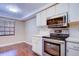 Modern kitchen with stainless steel appliances and ample cabinetry at 2020 Lakeview Dr # 203, Clearwater, FL 33763