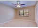 Bright bedroom with carpeted floor and ceiling fan at 2020 Lakeview Dr # 203, Clearwater, FL 33763