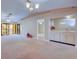 Open living room with wet bar and access to other rooms at 2020 Lakeview Dr # 203, Clearwater, FL 33763
