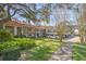 Condo building exterior showcasing landscaping, parking and building features at 2020 Lakeview Dr # 203, Clearwater, FL 33763