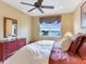 Bright bedroom with water views and a ceiling fan at 17371 Kennedy Dr, North Redington Beach, FL 33708