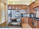 Modern kitchen with island, stainless steel appliances, and granite countertops at 17371 Kennedy Dr, North Redington Beach, FL 33708