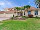 Grand two-story home with tile roof, three-car garage, and lush landscaping at 17371 Kennedy Dr, North Redington Beach, FL 33708