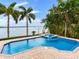 Inviting pool and spa with waterfront views at 17371 Kennedy Dr, North Redington Beach, FL 33708