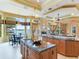 Open kitchen with large island, breakfast bar, and water views at 17371 Kennedy Dr, North Redington Beach, FL 33708