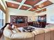 Relaxing Gathering room with leather sectional and built-in shelving at 17371 Kennedy Dr, North Redington Beach, FL 33708