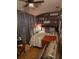 Inviting bedroom featuring warm lighting, wood accents, decorative shelves and stylish decor at 6015 19Th N St # 308, St Petersburg, FL 33714