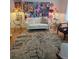 Cozy living room with a white loveseat, unique artwork, and stylish decor creating an inviting space at 6015 19Th N St # 308, St Petersburg, FL 33714