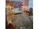 Living room boasts a white loveseat, eye-catching artwork, and an inviting space for relaxation at 6015 19Th N St # 308, St Petersburg, FL 33714