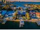 Exclusive waterfront estate featuring a private dock, pool, and breathtaking views of the bay at 516 Belle Isle Ave, Belleair Beach, FL 33786