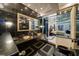 Bathroom with and sinks, black tile, Versace motif details, and access to the Primary bedroom at 516 Belle Isle Ave, Belleair Beach, FL 33786
