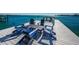 Inviting dock seating area, great for relaxing and enjoying bay views at 516 Belle Isle Ave, Belleair Beach, FL 33786
