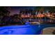 Private waterfront oasis with an inviting pool and dock perfect for entertaining as the sun sets at 516 Belle Isle Ave, Belleair Beach, FL 33786