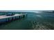 Dockside view with cozy Adirondack chairs overlooking bay at 516 Belle Isle Ave, Belleair Beach, FL 33786