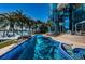 Luxurious waterfront home boasts a gorgeous pool, spa, and panoramic water views at 516 Belle Isle Ave, Belleair Beach, FL 33786