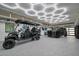 Spacious garage with epoxy floors, unique honeycomb lighting, and room for golf cart and SUV at 516 Belle Isle Ave, Belleair Beach, FL 33786