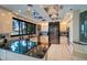 Modern kitchen with black countertops, stainless steel appliances, and a window overlooking the waterfront at 516 Belle Isle Ave, Belleair Beach, FL 33786