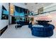 Modern living room with sleek fireplace, wet bar, and plush seating area overlooking the water at 516 Belle Isle Ave, Belleair Beach, FL 33786