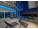 Waterfront outdoor patio with spiral staircase and seating, great for relaxing and entertaining at 516 Belle Isle Ave, Belleair Beach, FL 33786