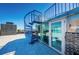A spiral staircase leads to a private roof top sun room and deck at 516 Belle Isle Ave, Belleair Beach, FL 33786