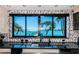 Close up shot of a sink with black countertops and a window overlooking the intercoastal waterway at 516 Belle Isle Ave, Belleair Beach, FL 33786