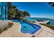 Relax by the pool or on your private dock at this waterfront home at 516 Belle Isle Ave, Belleair Beach, FL 33786