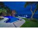 Outdoor entertaining area with waterfront views, pool and private dock at 516 Belle Isle Ave, Belleair Beach, FL 33786