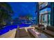 Enjoy a cocktail around the fire pit and pool with a water view at 516 Belle Isle Ave, Belleair Beach, FL 33786