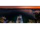This waterfront home features a private dock and sunset views at 516 Belle Isle Ave, Belleair Beach, FL 33786