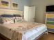 Beach-themed bedroom with king-size bed and dresser at 19930 Gulf Blvd # 1A, Indian Shores, FL 33785