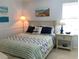 Bedroom with a full-size bed and coastal decor at 19930 Gulf Blvd # 1A, Indian Shores, FL 33785
